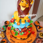 lion king fondant cake with cupcakes