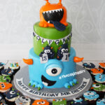 monster birthday cake and cupcakes