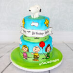2 tier snoopy and friends birthday cake